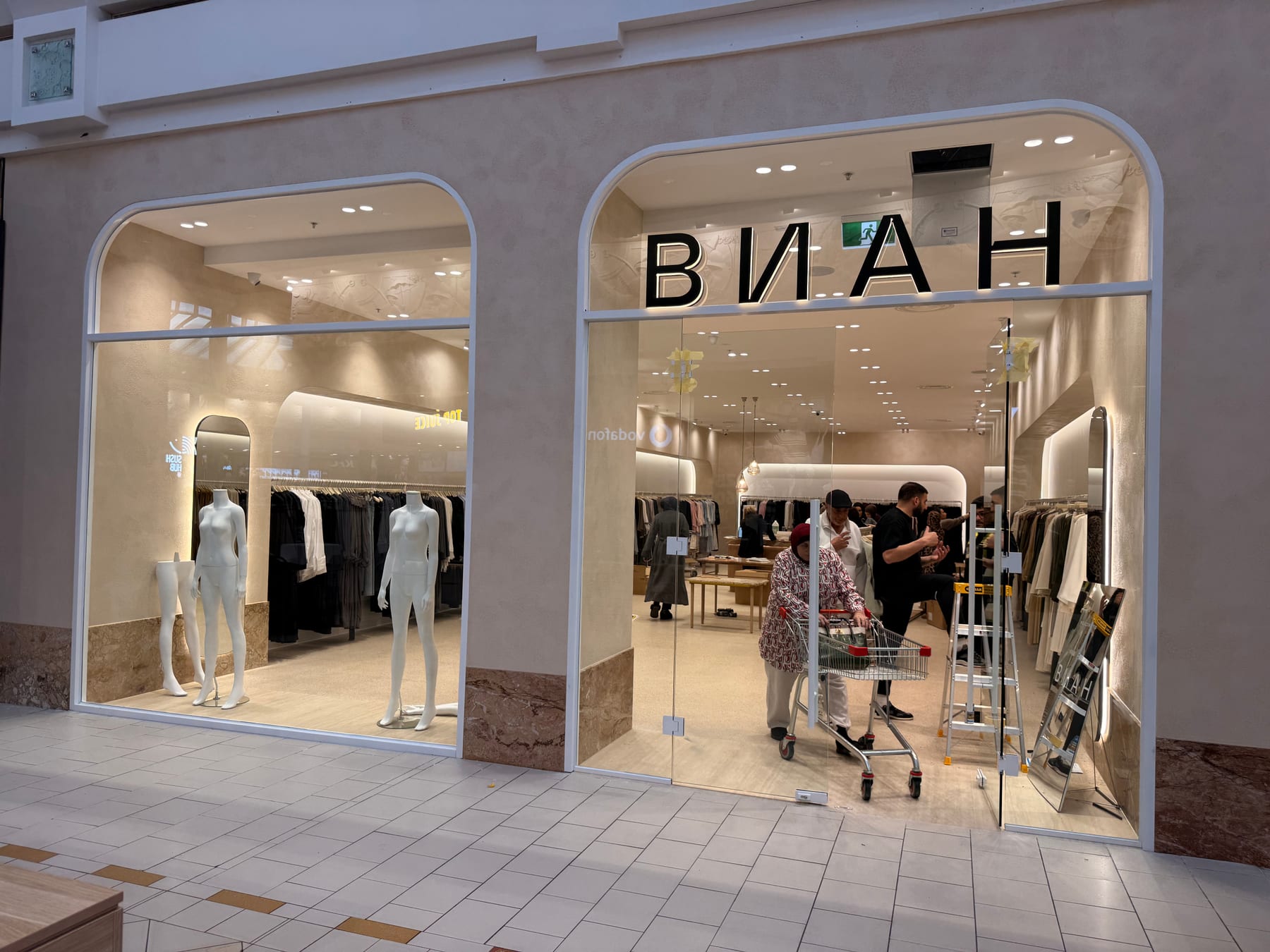 Completed commercial glass shopfront with white aluminium framing for a Melbourne retail fitout